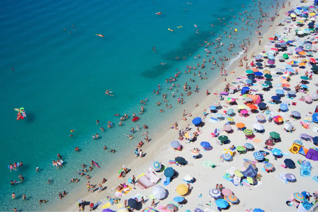 A view of people enjoying on a sunny beach.